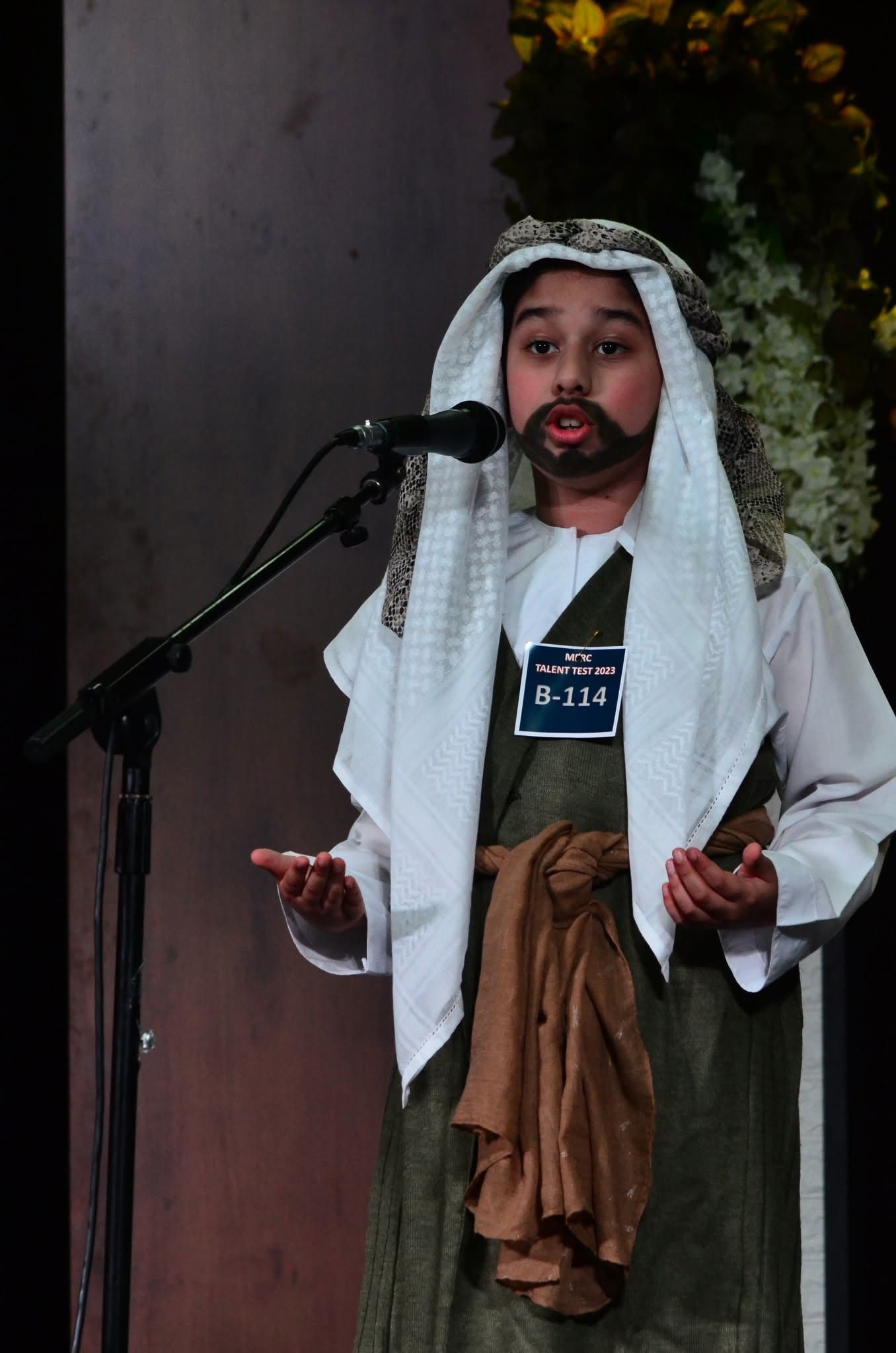Child in biblical costume at the Kids Church talent test